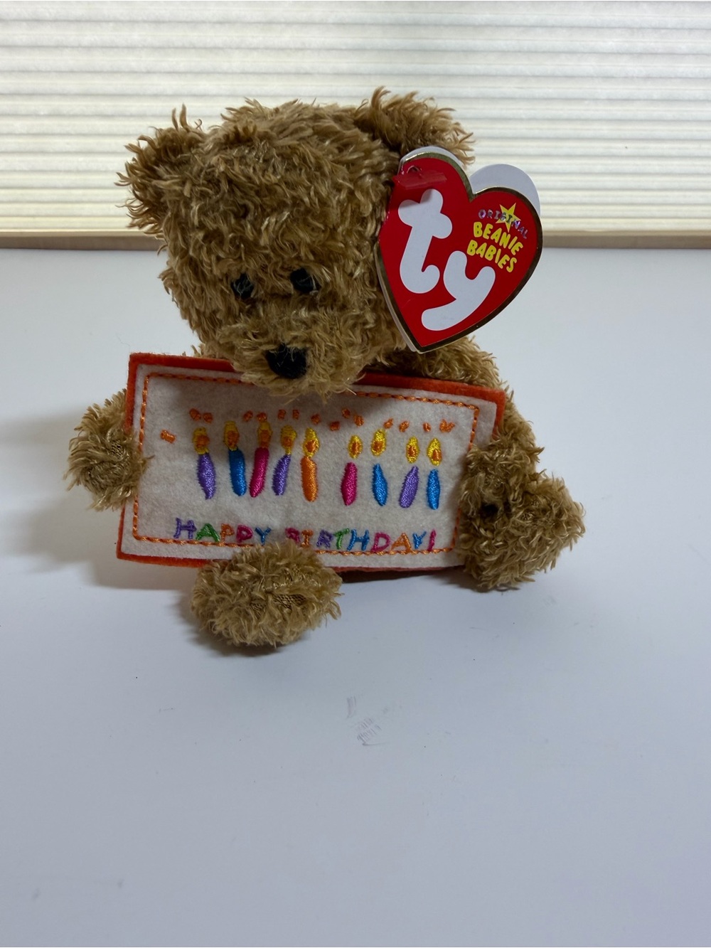 Ty Brown Beanie Baby Teddy Holding Colorful Birthday Banner Plush